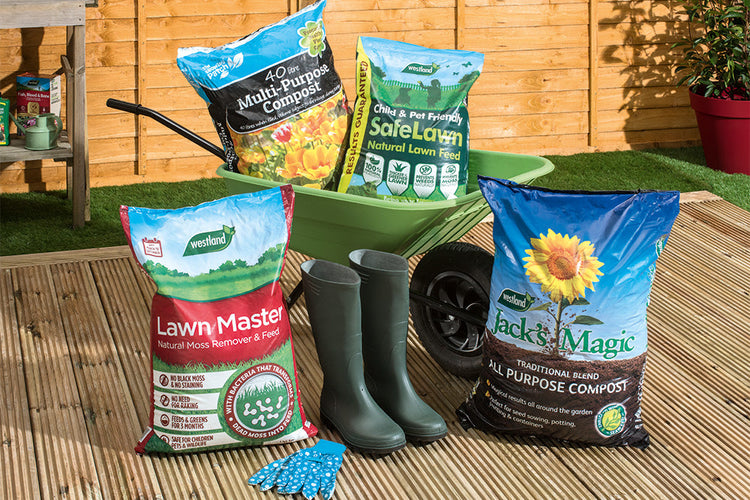 Garden care products neatly stored in a wheelie bin next to a pair of wellington boots