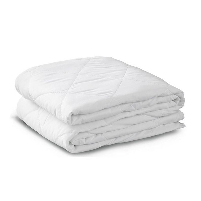 Folded white quilted mattress protectors