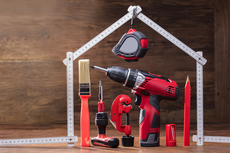 Range of tools under a house shape, including a drill and paintbrush