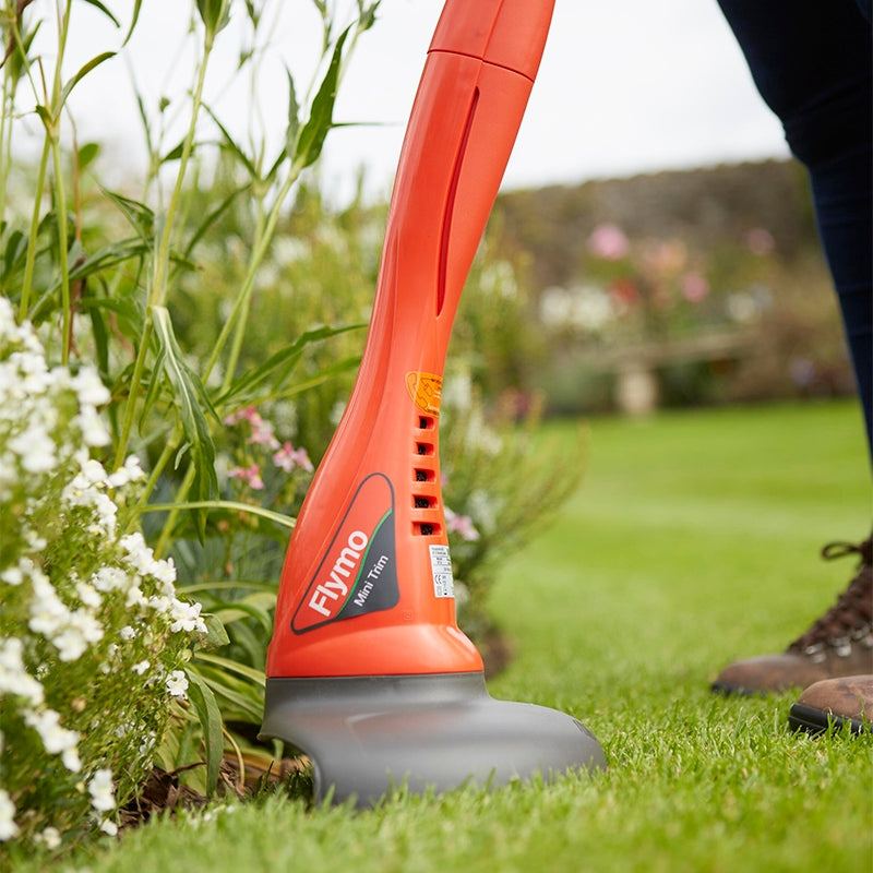 Grass strimmer getting rid of weeds and cutting grass