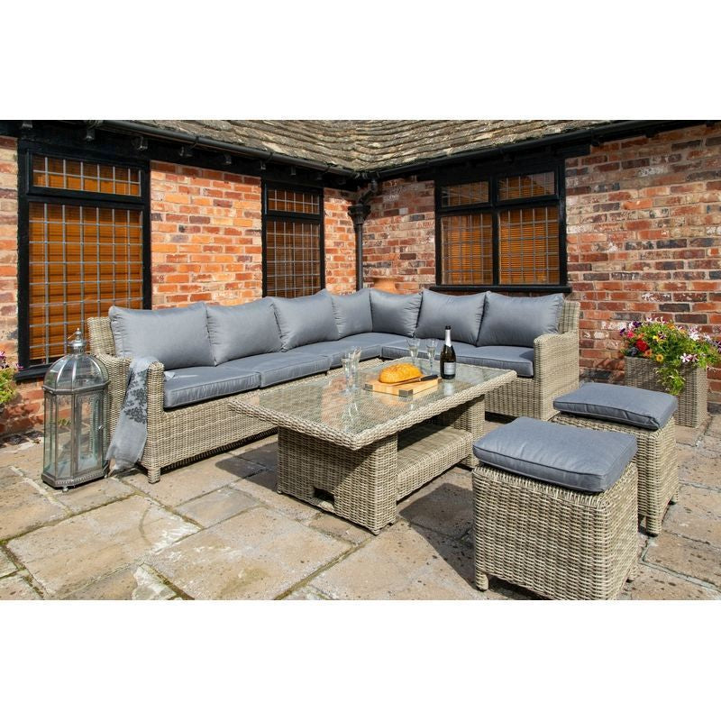 Rattan garden sofa set placed on the grass on a sunny day