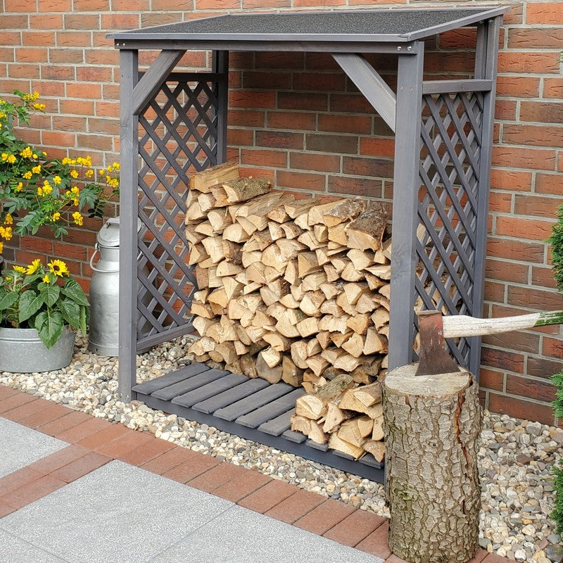 A log store filled with neatly stacked firewood 