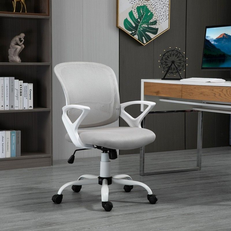 Basic office chair with rolling wheels next to a desk 