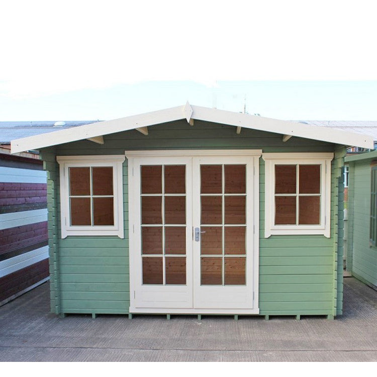 A charming blue garden log cabin featuring French doors,