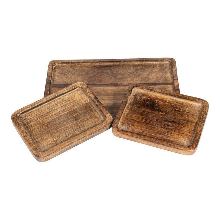 Three different sized wooden trays spread out 