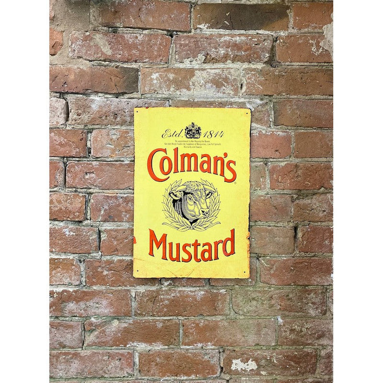 Colmans Mustard retro metal sign placed on a brick wall