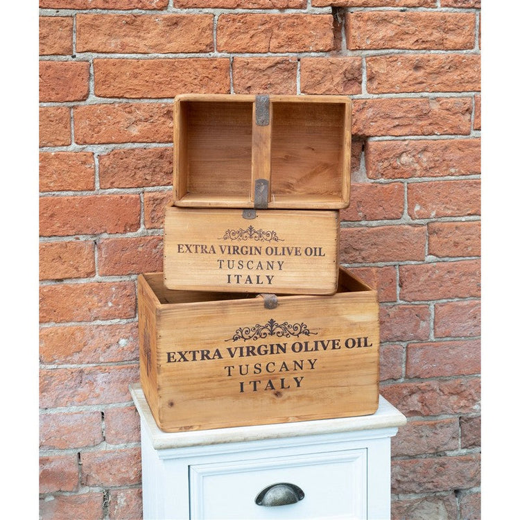 Three small wooden storage boxes stacked on top of eachother