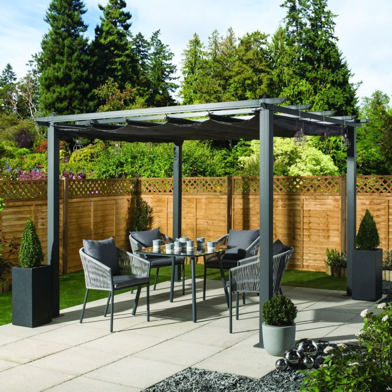 A spacious 3x3 croft gazebo positioned on a patio, providing shade for a stylish dining set arranged underneath