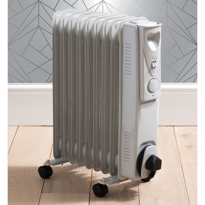 Radiator on a wooden floor, transportable with wheels