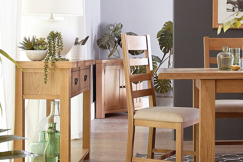 Solid oak dining table and chairs set, showcasing timeless elegance and sturdy craftsmanship for a dining room