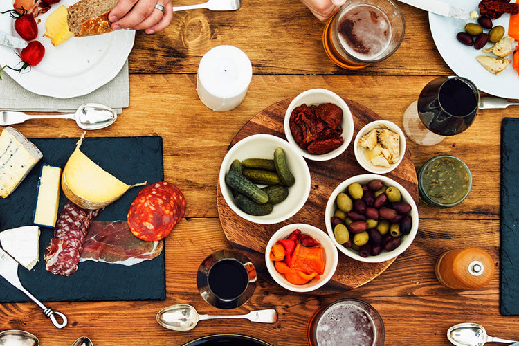 Flood platter on wooden table with black placemats